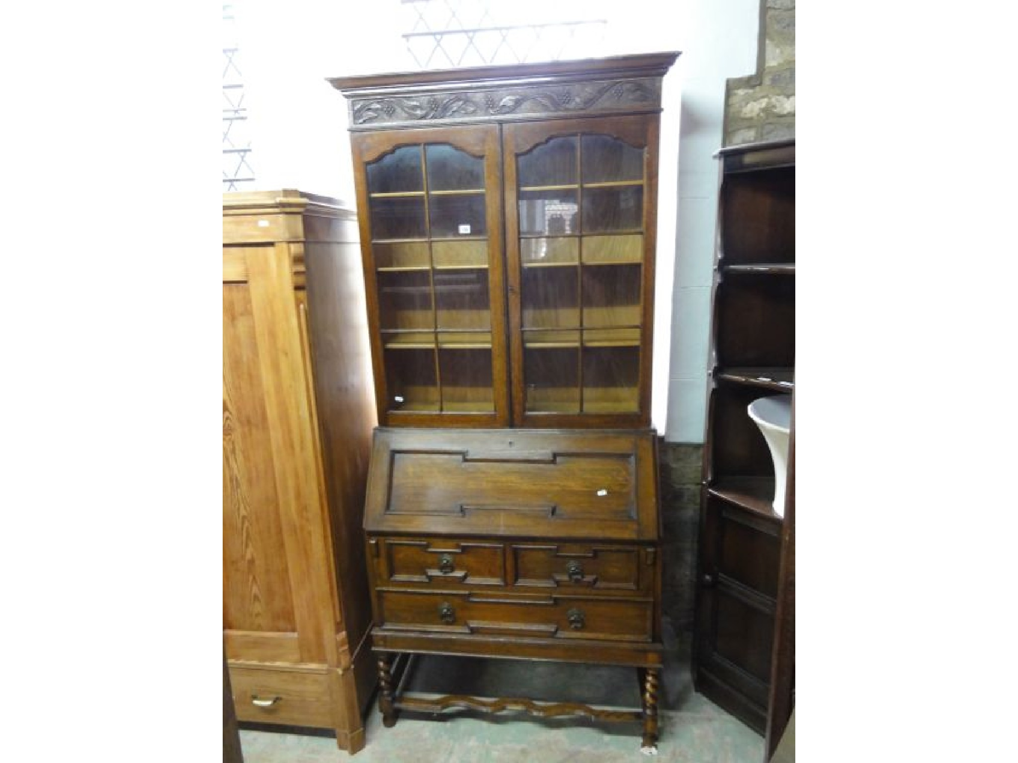 An Edwardian 1920 s Jacobean revival oak bureau bookcase the