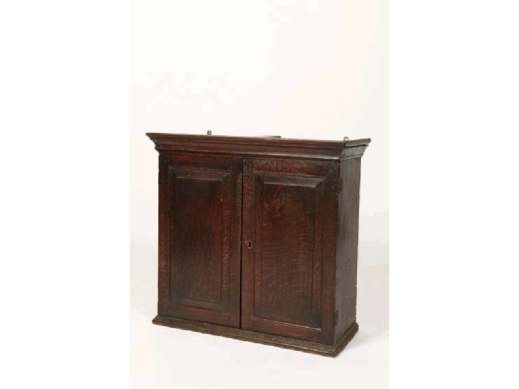 A GEORGE III OAK WALL CUPBOARD with a moulded cornice