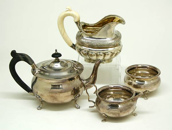 A Russian 84 standard silver cream pitcher with carved ivory