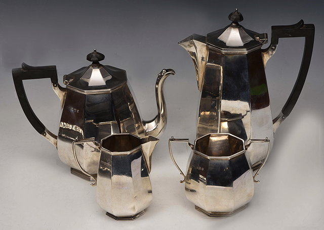A SILVER THREE PIECE TEA SERVICE of octagonal section comprising