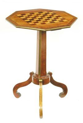 A 19th century walnut and brass mounted games table the