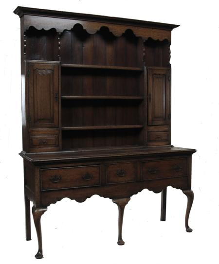A George III style oak dresser the projected moulded cornice