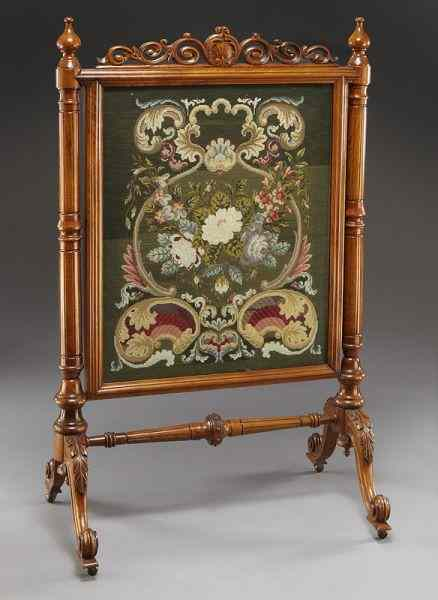 Victorian framed needlepoint firescreensupported by turned and paneled columns on