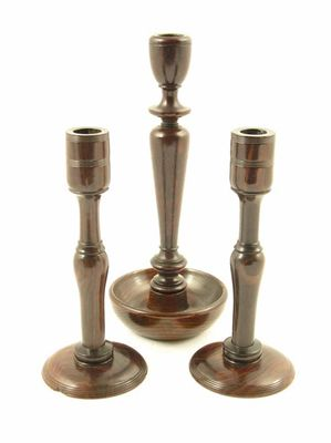 A pair of turned hardwood candlesticks 8in 20 4cm h