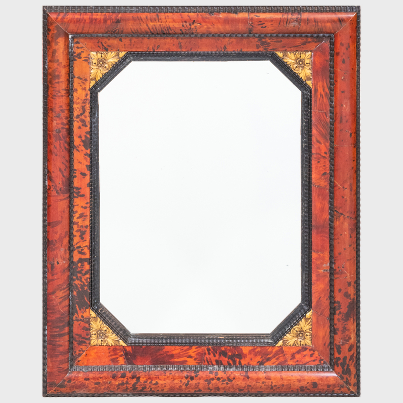 FLEMISH BAROQUE STYLE FAUX TORTOISESHELL EBONIZED AND PARCEL GILT MIRROR