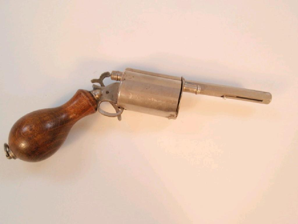 An early 20thC novelty Gun pen and pencil with firing