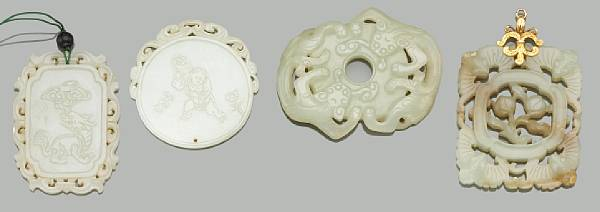 Eleven nephrite pendants 19th Century and Later Including three reticulated
