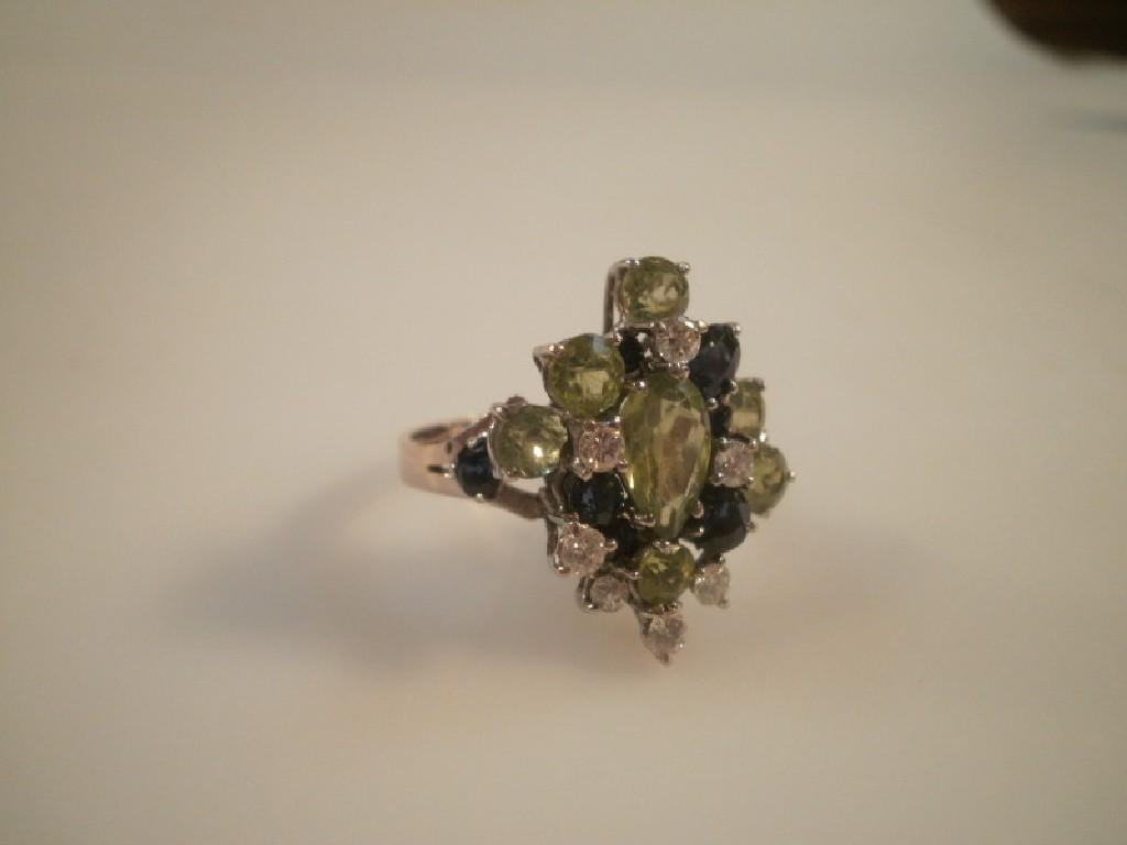 A multi stone set dress ring small diamonds sapphires and