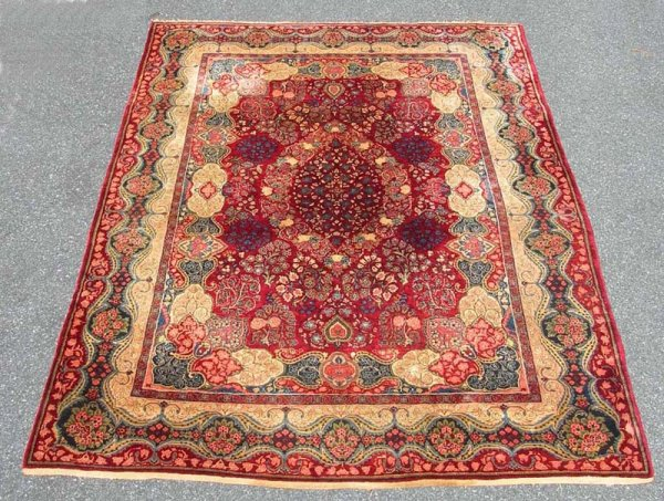 Room size Persian rug Central medallion on dark red ground