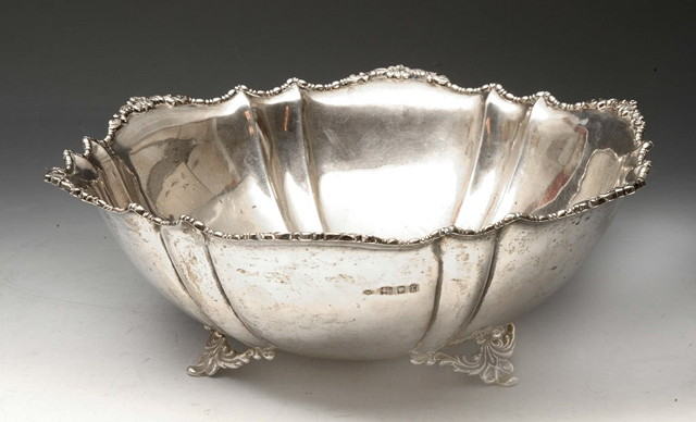 A OPEN SILVER BOWL of stylised hexagonal form with shaped