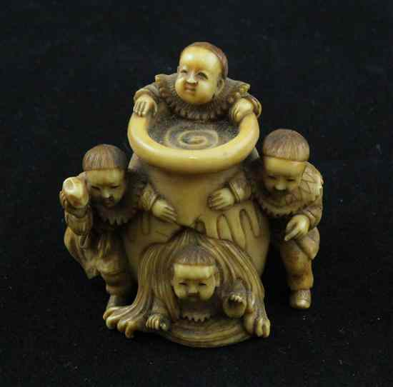 A stained ivory netsuke carved with Shiba Onko saving his
