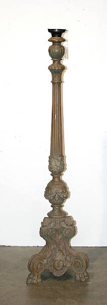 An Italian Baroque style painted and carved wood torch re