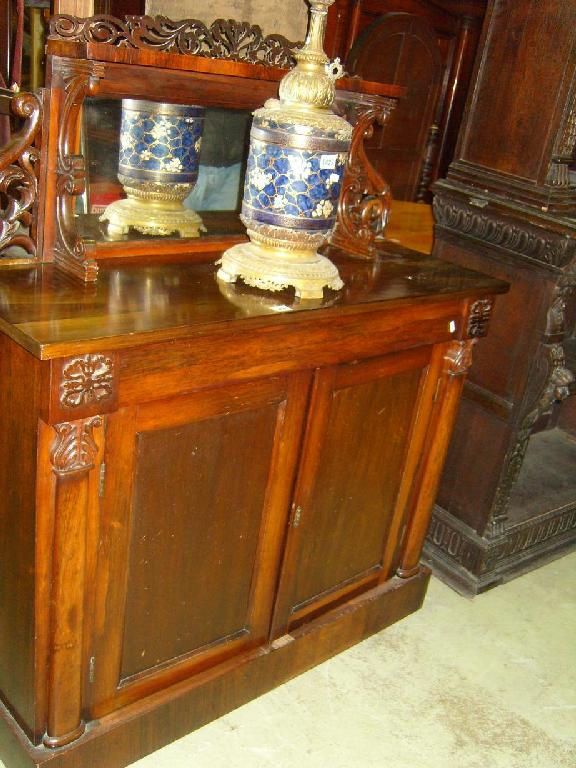 A William IV rosewood chiffonier fitted with a frieze drawer