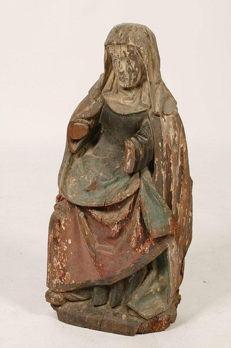 A NETHERLANDISH OAK FIGURE of a seated female saint with