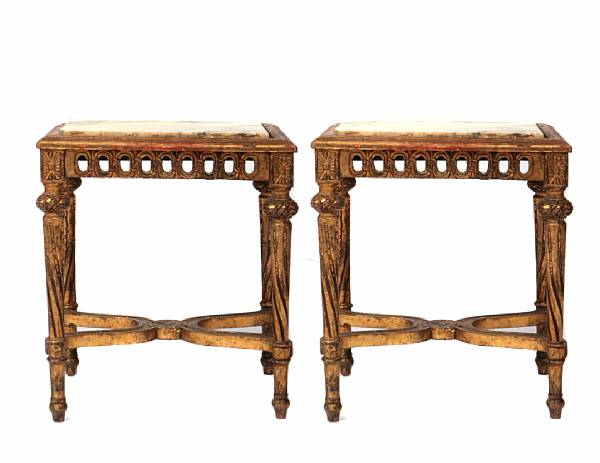 A pair of Italian rectangular carved and gilded tables with