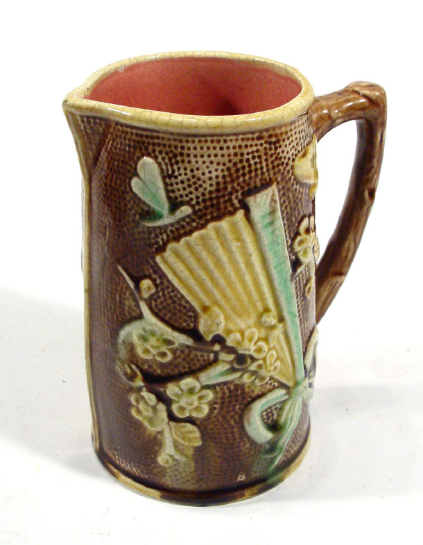 Victorian Majolica pottery jug relief moulded with a band of