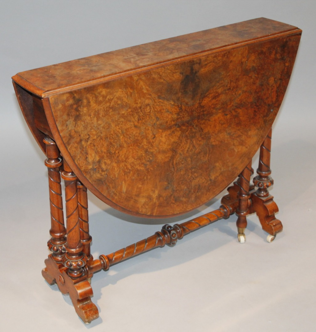 A late 19thC burr walnut gateleg Sutherland table the moulded
