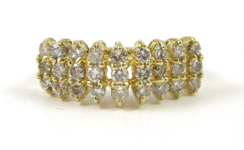DIAMOND AND FOURTEEN KARAT GOLD RING set with 27 round