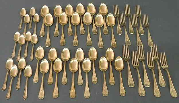 Partial sterling silver gold washed flatware service by Bailey Banks