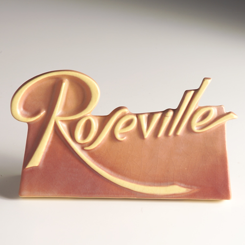 ROSEVILLE Dealer s sign with scrolled ivory letters on a