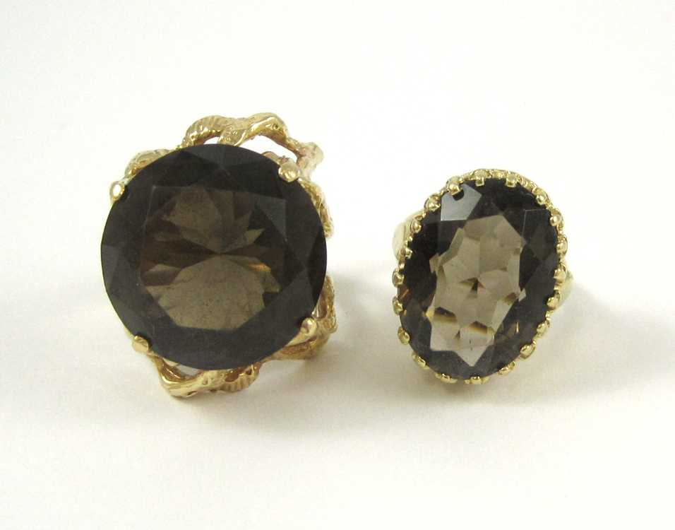 TWO SMOKY QUARTZ AND YELLOW GOLD RINGS including a size