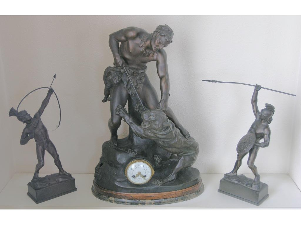 A late 19th Century bronzed spelter mantel clock after Thomas