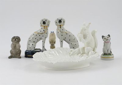 A Minton white glazed leaf dish surmounted with a squirrel