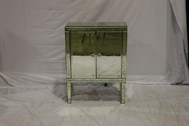 An Italian mirrored cocktail cabinet retailed by Mark Foy s