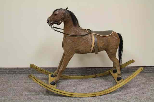 CHILD S ROCKING HORSE Full figure with natural hide covering