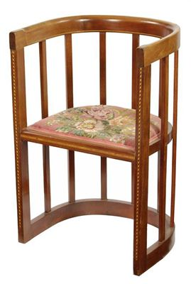 An Arts and Crafts mahogany tub chair with stringing and