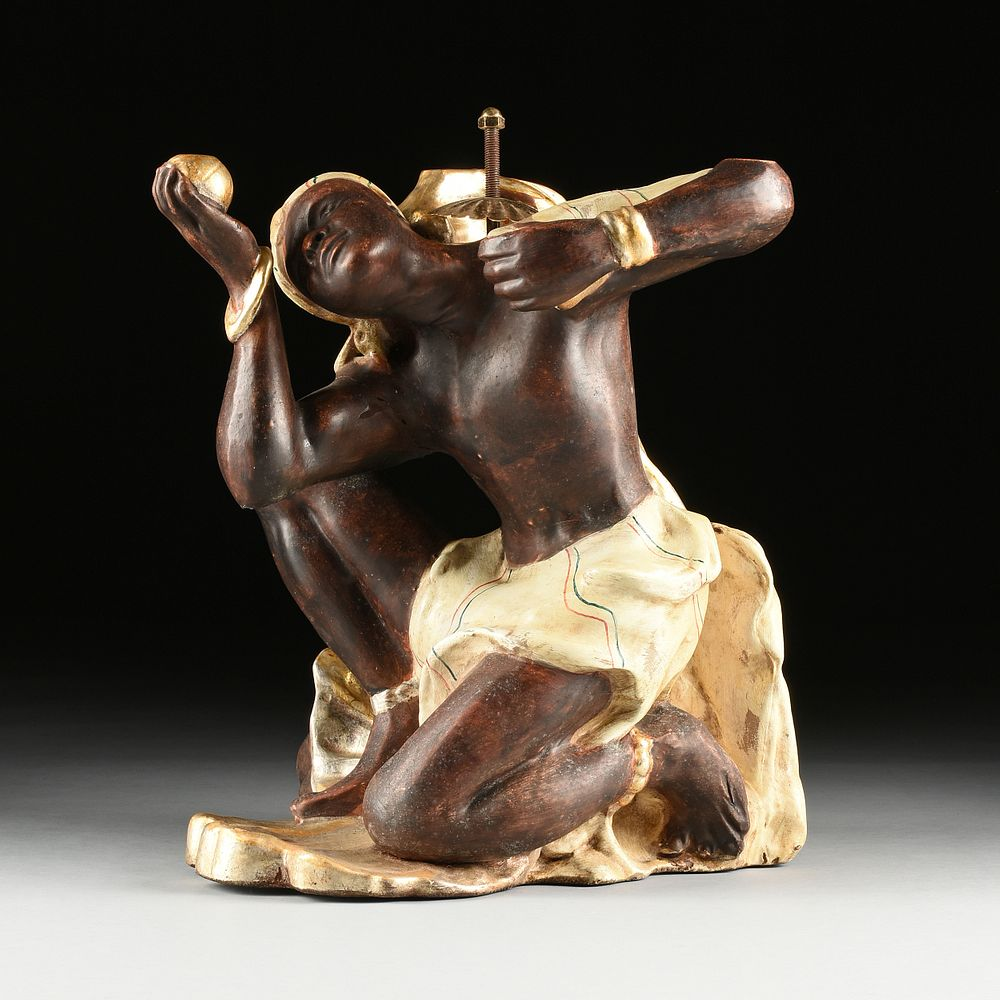 AN ITALIAN GROTTO STYLE SILVER AND GOLD LEAFED WOOD BLACKAMOOR
