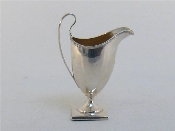 A George III silver helmet cream jug maker s mark