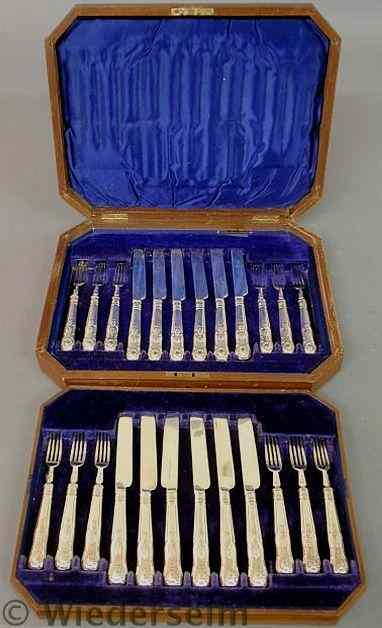 Set of twelve English silver fish forks and knives in