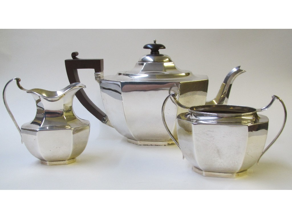 A silver three piece tea service of octagonal form Chester