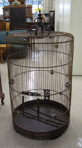 A LARGE CHINESE BIRD MARKET BIRDCAGE of cylindrical wood construction