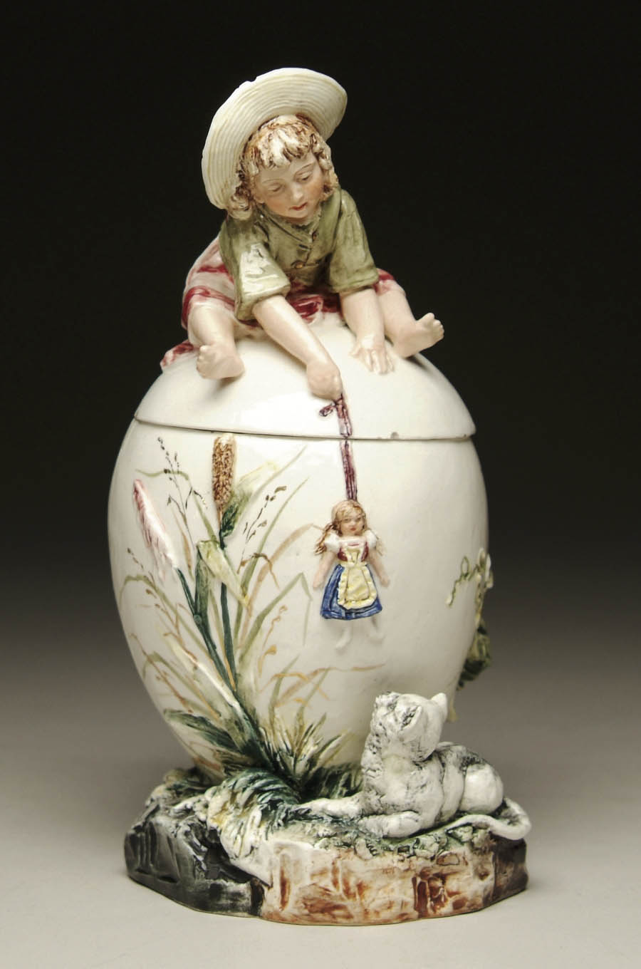 CHARMING EGG SHAPED MAJOLICA HUMIDOR Lid with figural straw bonneted