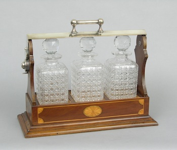 A Hepplewhite Style Tantalus A handsome Hepplewhite style tantalus with