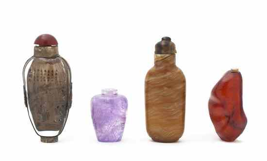 A Group of Four Snuff Bottles including one amber example