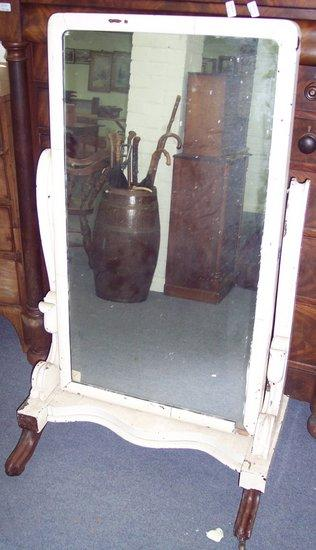 A Victorian mahogany cheval glass the rounded rectangular mirror on