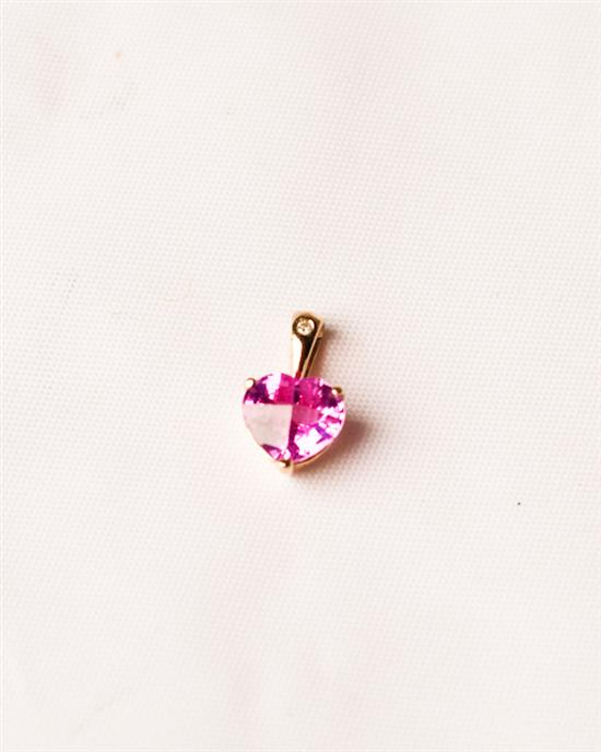 Heart shaped Synthetic Pink Sapphire Pendant set in 14k Gold