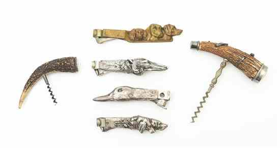 A Group of Three Silverplate Cigar Cutters two of dog