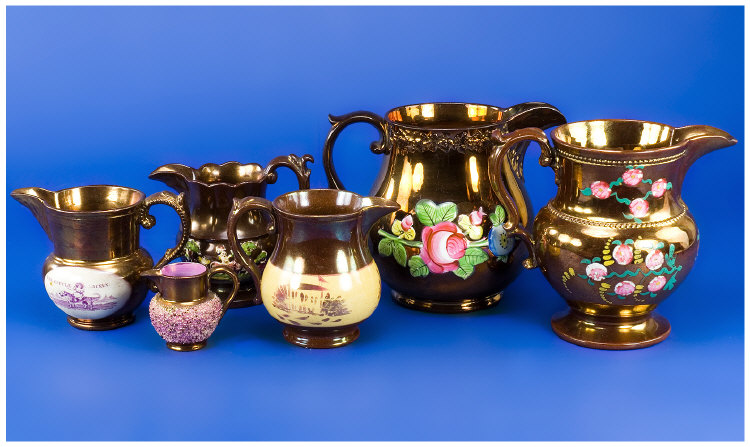 Six Copper Lustre Jugs One with Puce Transfer Print The