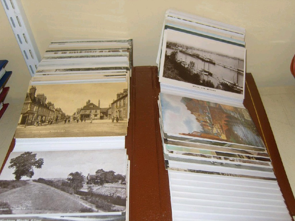 An album of early 20th century humorous postcards including examples