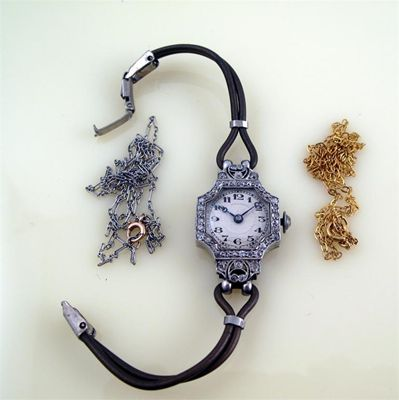 A lady s diamond set platinum wrist watch the square
