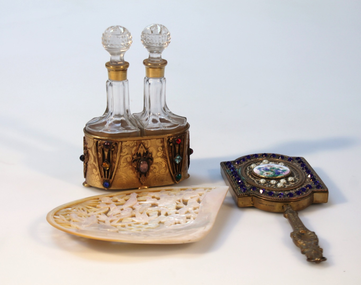 Various decorative items comprising a hand mirror the inverted glass