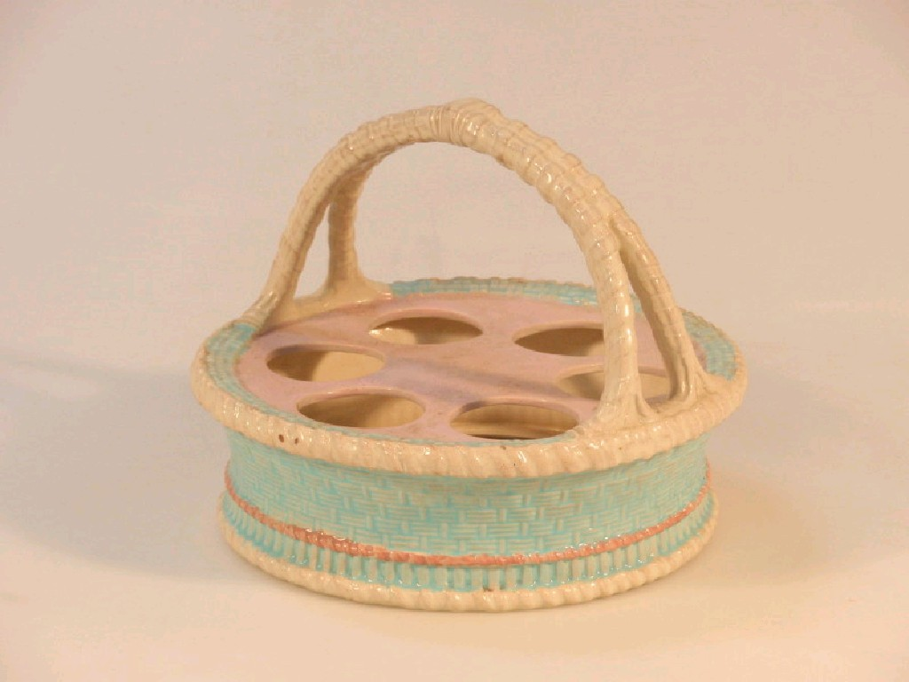 A 19thC Worcester earthenware egg stand modelled as a circular