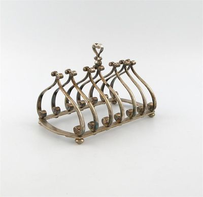 By Theo Fennell a modern silver seven bar toast rack