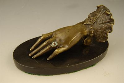 A late 19th century bronze clip modelled as a ladies