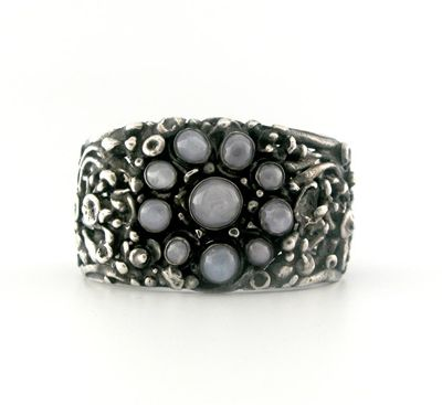 An Arts and Crafts Sapphire Bangle The silver bangle is