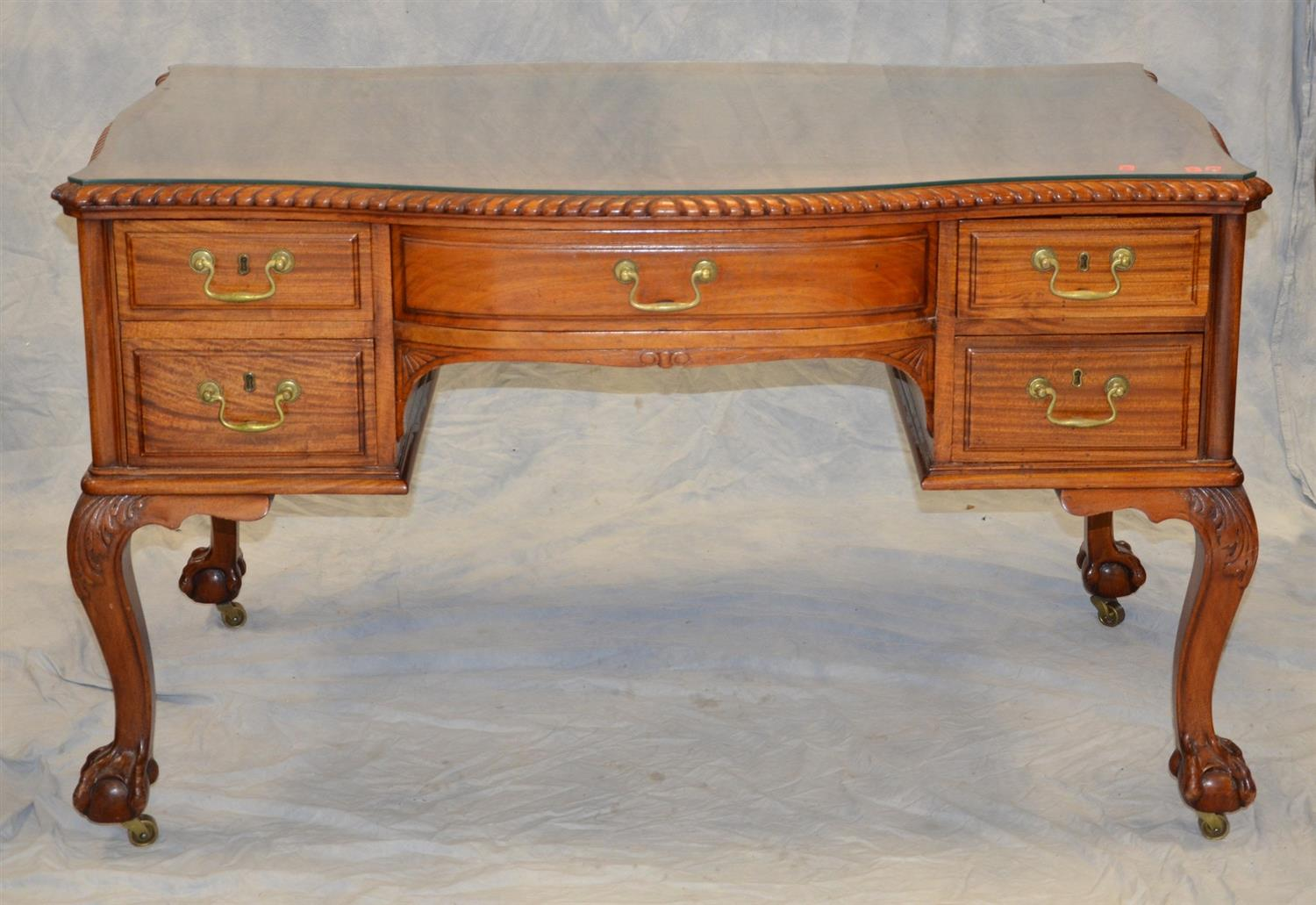 Carved mahogany Centennial Chippendale style faux partner s desk serpentine